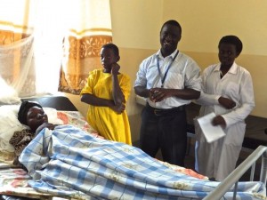 Malaria patient with daughter,Dr. Ronald,and nurse